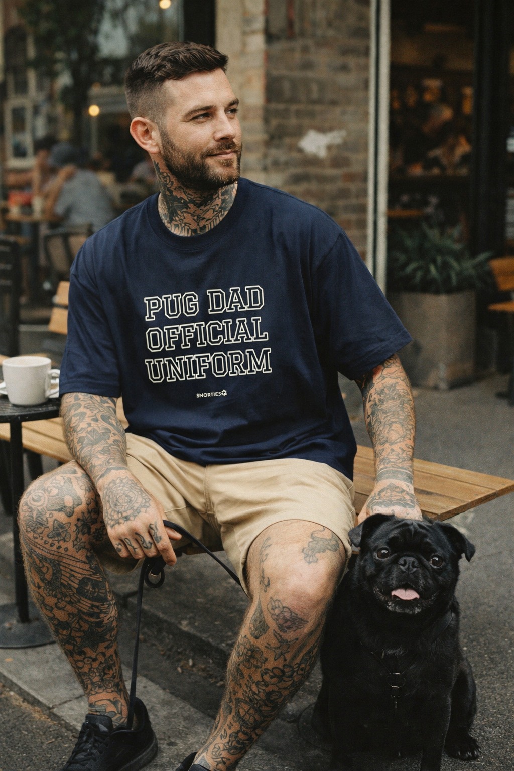 Snorties Pug Dad oversized T-shirt featuring a casual fit, with a pug graphic and "Dad" text on soft cotton fabric.