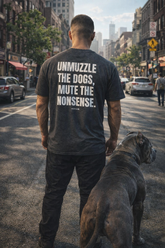 Snorties Unmuzzle the Dogs oversized T-shirt featuring bold graphic design and casual fit, perfect for dog lovers.